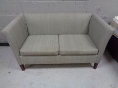 A twentieth century continental two seater settee in grey fabric