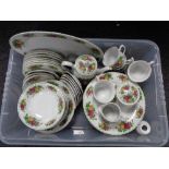 A box of Trade Winds Country Roses tea and dinner ware
