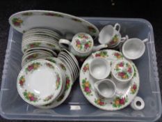 A box of Trade Winds Country Roses tea and dinner ware