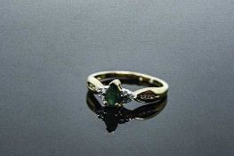 A 10ct yellow gold emerald and diamond ring, approximately 0.25ct emerald, size M.