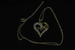 A 10ct yellow gold diamond heart pendant on yellow gold chain, approximately 0.25ct.