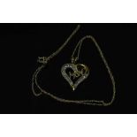 A 10ct yellow gold diamond heart pendant on yellow gold chain, approximately 0.25ct.