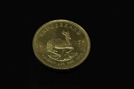 A South Africa gold 1 oz Krugerrand 1975.