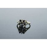 A 10ct gold diamond and sapphire cluster ring, 2.8g, size N/O.