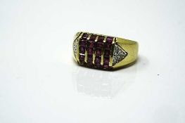 A good quality 18ct yellow gold ruby signet ring set with diamond shoulders, 7.1g, size N.