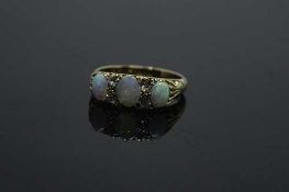 An antique 18ct gold opal and diamond ring, size M/N.
