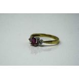 An 18ct yellow gold ruby and diamond ring, 2.5g, size M/N.