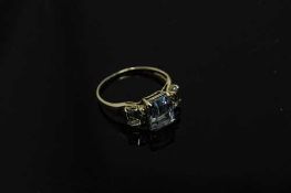 A 10ct gold blue topaz and diamond set ring, size O.