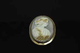 An antique rose-gold cameo brooch, 43 mm x 54 mm.