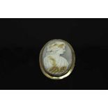 An antique rose-gold cameo brooch, 43 mm x 54 mm.