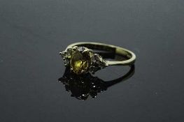 An 18ct yellow gold citrine and diamond ring, size O.