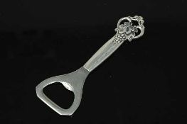 A heavy gauge Danish silver bottle opener signed COHR.