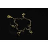 A 9ct gold bracelet with three 9ct gold charms, 10.4g gross.