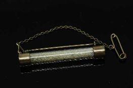 An antique yellow metal mounted cylinder bar brooch filled with opal chips, length 5 cm.
