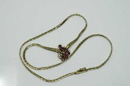 An 18ct gold ruby and diamond necklace, 12.45g.