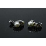 A pair of 14ct white gold pearl and diamond earrings, 4.5g, approximately 0.12ct diamond weight.