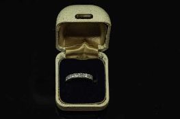 An 18ct gold seven stone half eternity diamond ring, approximately 0.5ct, size M/N.