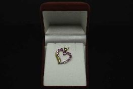 A 14ct gold heart shaped pendant set with 1.25ct of pink tourmaline and diamond.