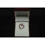 A 14ct gold heart shaped pendant set with 1.25ct of pink tourmaline and diamond.