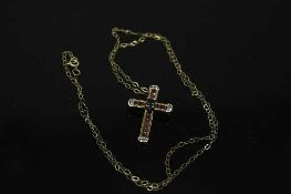 A 10ct yellow gold sapphire, ruby and diamond cross pendant on chain, pendant weight 1.