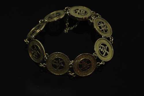 A 14ct gold Chinese panel bracelet, 14.8g.