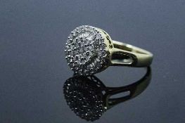 An 18ct gold diamond cluster ring, set with round and baguette cut stones, size J/K, 4.5g.