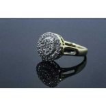 An 18ct gold diamond cluster ring, set with round and baguette cut stones, size J/K, 4.5g.