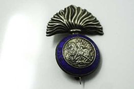 A silver and enamel Northumberland Fusiliers Sweetheart brooch, Birmingham 1915.