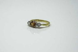 An 18ct yellow gold citrine and diamond ring, size J.