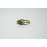 An 18ct yellow gold citrine and diamond ring, size J.