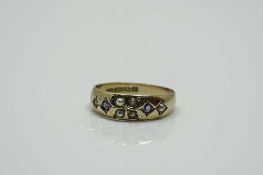 A 15ct gold sapphire and pearl ring, size K.