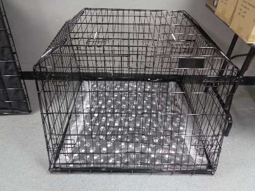 A folding black metal dog cage, height 74 cm, width 98 cm, depth 96 cm.