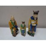 Three twentieth century glazed pottery figures of Chinese elders