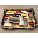 A collection of boxed and unboxed die cast vehicles including buses,