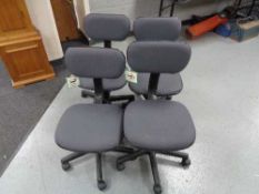 Four grey swivel typist chairs