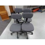 Four grey swivel typist chairs