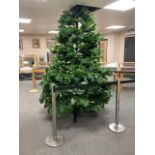 A good quality 8 foot Christmas Tree with adjustable branches and pine cones.