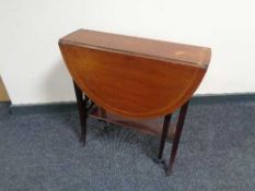 A Victorian inlaid mahogany Sutherland table