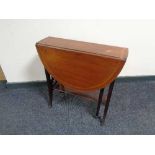 A Victorian inlaid mahogany Sutherland table