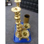 A pair of heavy brass pricket candlesticks on paw feet together with a further pair of brass