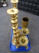 A pair of heavy brass pricket candlesticks on paw feet together with a further pair of brass