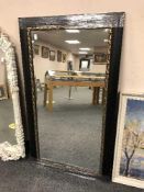A black framed mirror