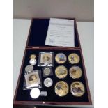A case of fourteen assorted coins, gold plated James Cook collection with certificate, St.