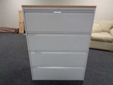 A four drawer metal document cabinet with oak effect top with no key