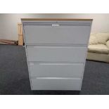 A four drawer metal document cabinet with oak effect top with no key