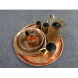 A collection of twentieth century copper ware, trays, bowls, measures,