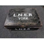 A metal deed box with hand painted writing L.N.E.R.