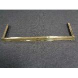 A brass extending fire curb