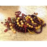 A very large quantity of cherry and amber coloured beads and necklaces CONDITION REPORT: