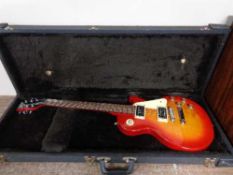 An Epiphone Les Paul electric guitar in hard shell case